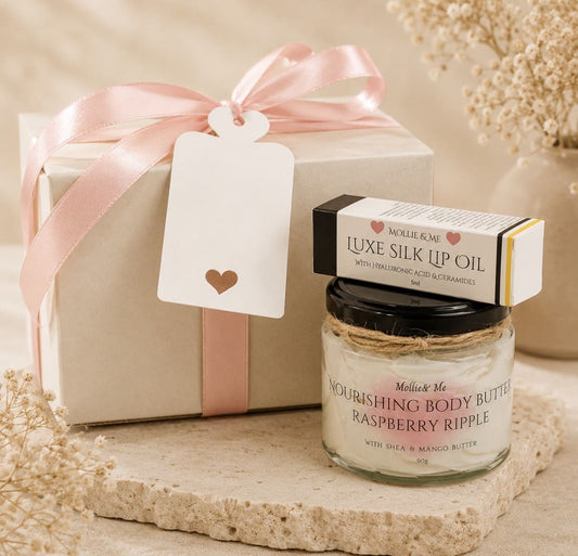 Handmade lip oil and body butter skincare gift set in a white gift box with pink ribbon by Mollie & Me Skincare.