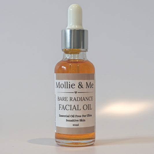 Natural Face Oil For Sensitive Skin, with rosehip oil and Seabuckthorn. Orange hue I'm a 30ml glass dropper bottle with pippet and a mollie and me skincare label 