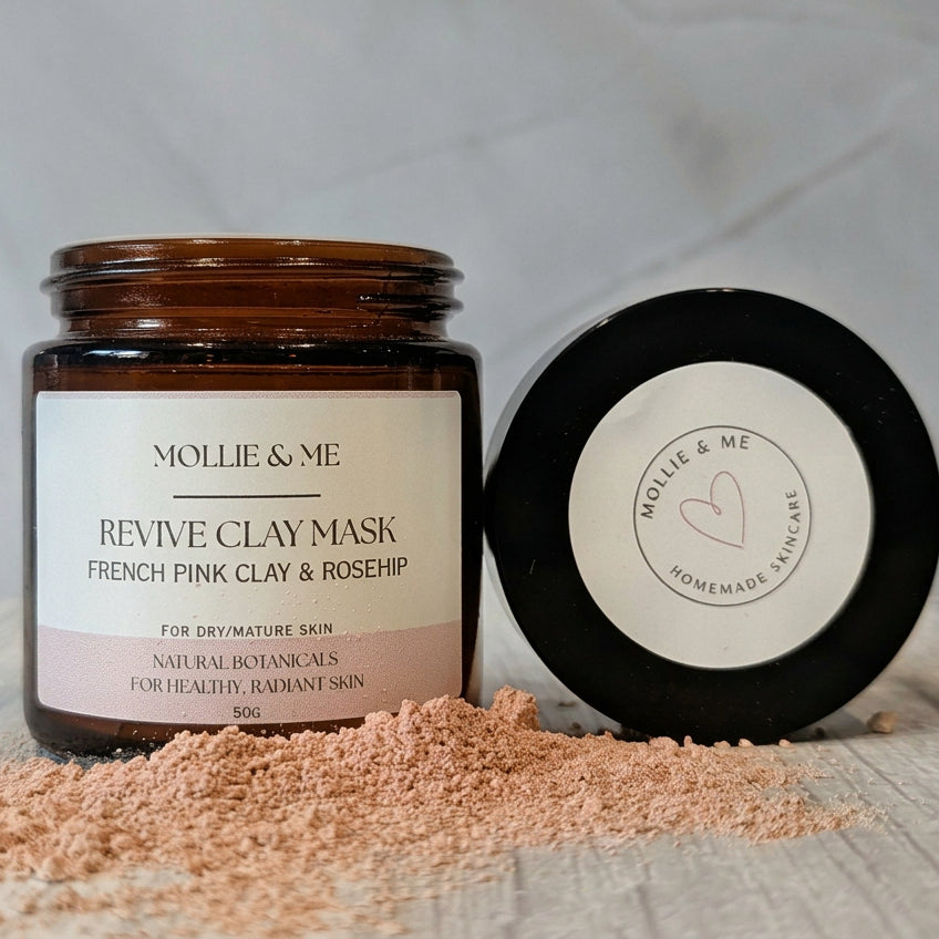  A jar of Mollie & Me botanical clay mask for dry, mature skin in an amber glass jar. French pink clay and rosehip. Made in Kent in small batches.