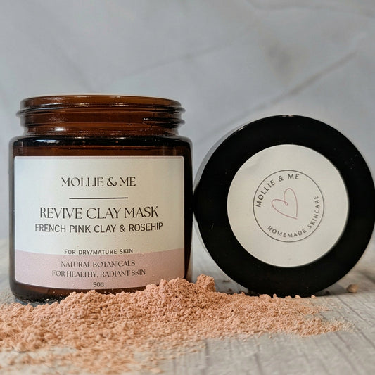  A jar of Mollie & Me botanical clay mask for dry, mature skin in an amber glass jar. French pink clay and rosehip. Made in Kent in small batches.
