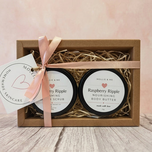 A Mollie & Me skincare pamper giftset containing a 100g sugar scrub and a 55g Shea body butter. Free from SLS and parabens. Choice of scents and packaged in a brown gift box with clear window sleeve, ribbon and a gift tag. Skincare made in small batches in Kent.